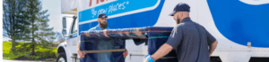 Two Atlas movers carrying a table