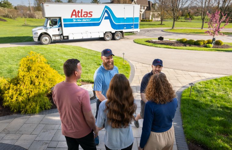 Atlas Movers truck parked outside a home in New Jersey, ready for a residential moving job.