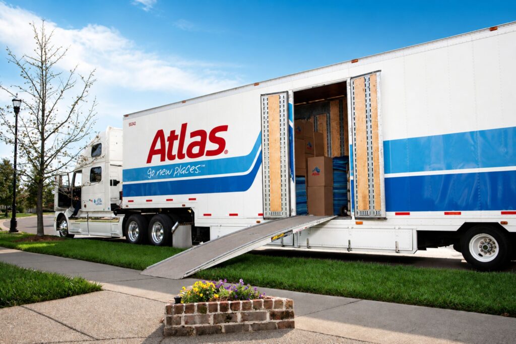 Atlas truck parked on a road, showcasing its vibrant color scheme.