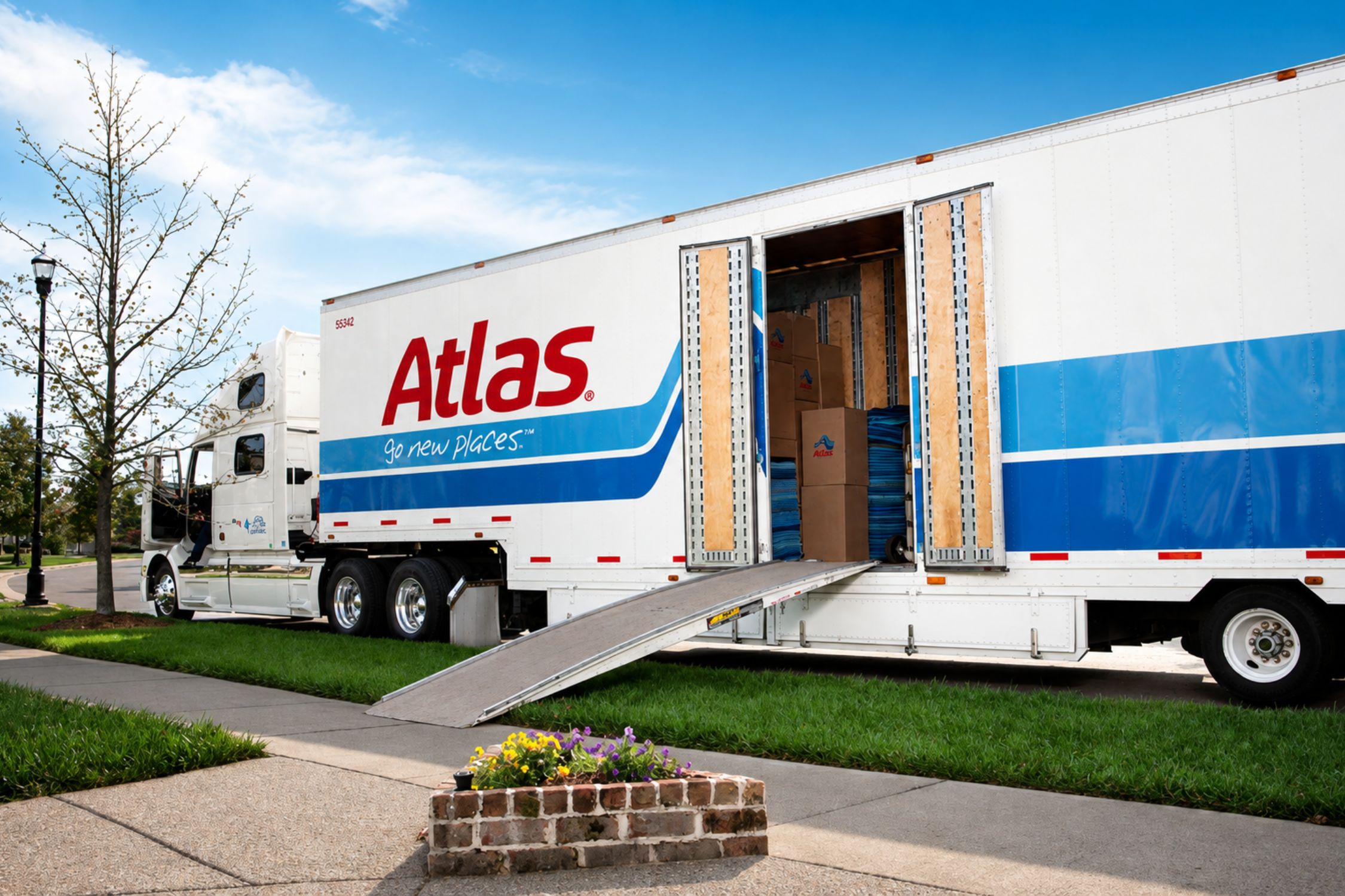 Atlas truck parked on a road, showcasing its vibrant color scheme.